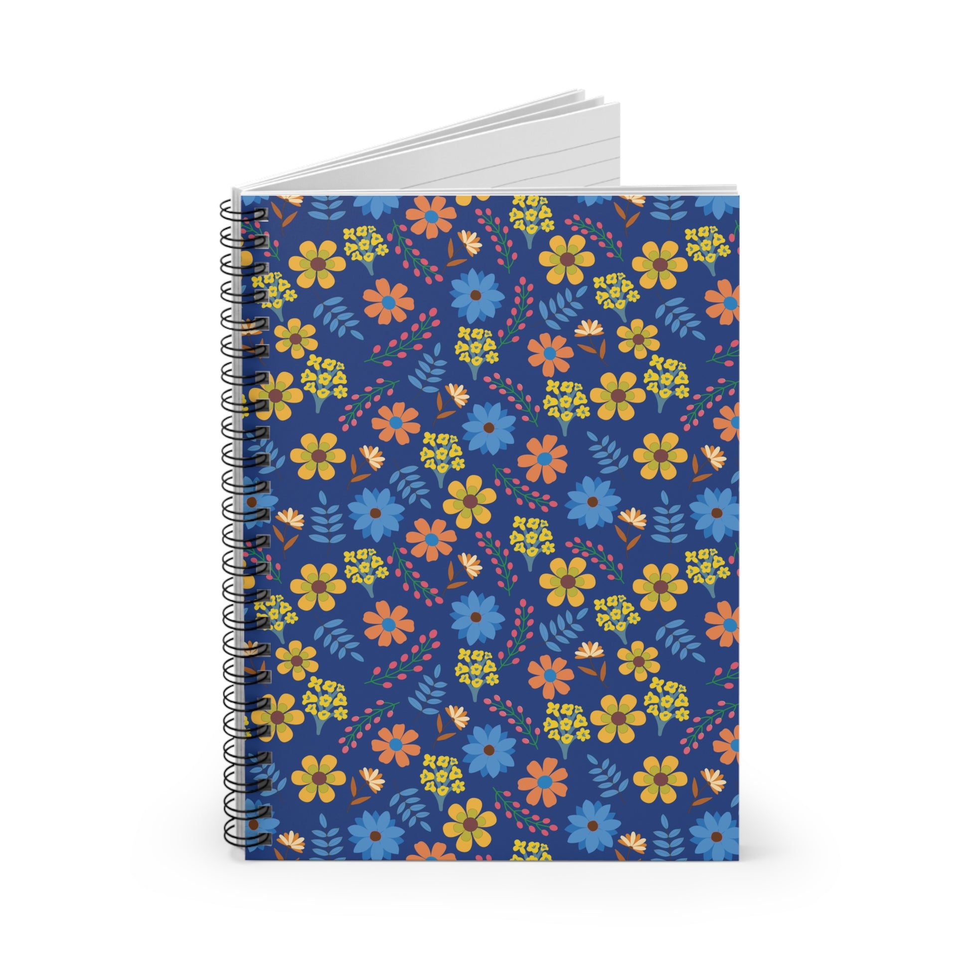 Floral Spiral Notebook with vibrant orange, yellow, and blue floral pattern on navy cover, standing upright. White, lined pages visible at top, embodying FireBrook Designs' cheerful and uplifting style.