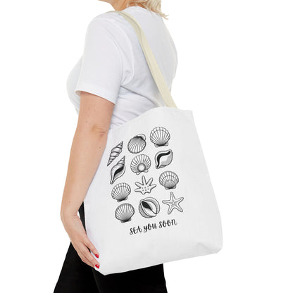 Sea Shells Tote Bag featuring a beachy design, durable polyester fabric, and reinforced stitching, perfect for seaside trips and carrying essentials, reflecting FireBrook Essentials' uplifting and stylish product ethos.