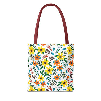 Floral Tote Bag featuring vibrant yellow and orange flowers with green leaves and blue accents on a white backdrop, complemented by burgundy-red handles, embodying FireBrook Designs' cheerful and uplifting style.