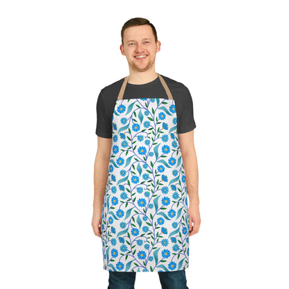 Man wearing Apron Floral Design, featuring a vibrant botanical print of stems and flowers, with a tan neck strap and tie-back closure, embodying FireBrook Essentials' stylish, comfortable apparel ethos.