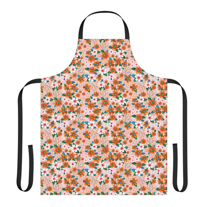 Floral Apron featuring a vibrant dense floral pattern on pale pink, with black neck strap and waist ties, crafted from stain-free polyester canvas, offering comfort and style for cooking or crafting.