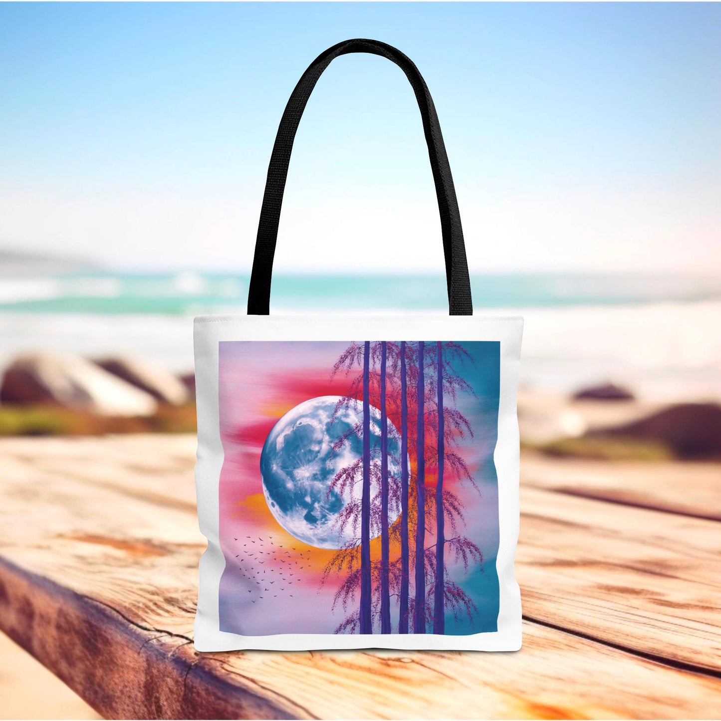 Moonlit Landscape Tote Bag showcasing a vibrant full moon, silhouetted trees, and fiery sunset, ideal for nature enthusiasts and artists. Durable polyester, reinforced handles, available in various sizes. Perfect for daily use or gifting.