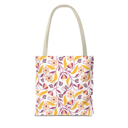Floral Tote Bag with natural straps features a vibrant pattern of blossoms, buds, and leaves in warm hues, perfect for summer outings or beach trips. Durable and stylish, ideal for cheerful design lovers.