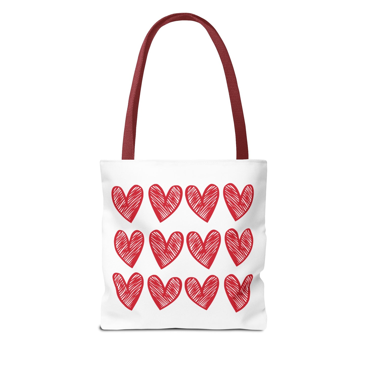 Hearts Tote Bag: A stylish white tote adorned with vibrant red hearts, perfect for adding a playful touch to your outfit. Durable and spacious, it embodies FireBrook Designs' uplifting and joyful aesthetic.