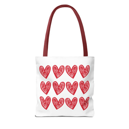 Hearts Tote Bag: A stylish white tote adorned with vibrant red hearts, perfect for adding a playful touch to your outfit. Durable and spacious, it embodies FireBrook Designs' uplifting and joyful aesthetic.