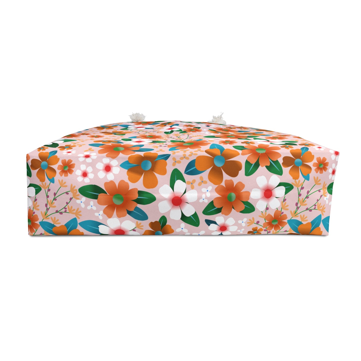 Rectangular Weekender Bag with floral-patterned pink fabric, featuring orange, white, and teal flowers. Two short ties are visible, ideal for stylish travel.