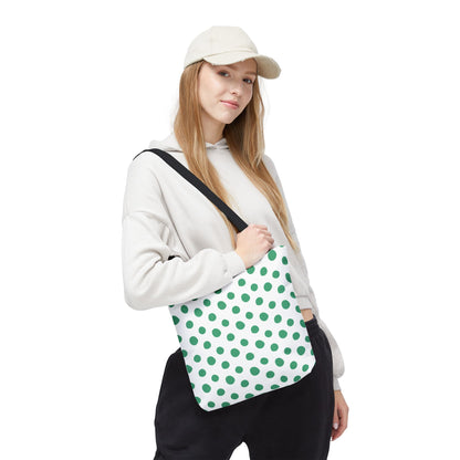 A woman holds a Green Polka Dots Tote Bag, showcasing its playful design and spacious boxed shape, perfect for adding a cheerful touch to casual outfits.