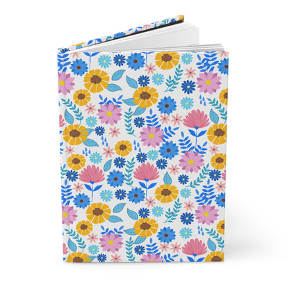 HARDCOVER JOURNAL, MATTE, RULED, 5X7, SEWN BIND, CLEAN-TEAR PAGES – CHEERFUL BLOOMS MIX features a vibrant floral pattern with blue, pink, and yellow flowers, offering 150 lined, perforated pages for joyful writing.