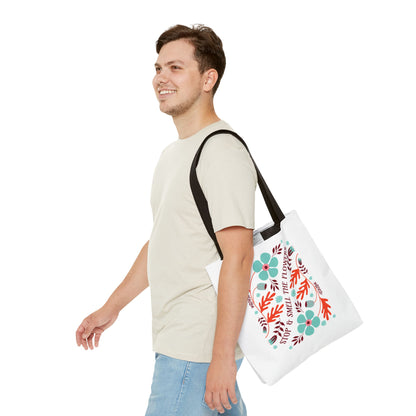 Stop and Smell The Flowers Tote Bag carried by a smiling man; features floral design, durable polyester, and reinforced handles, ideal for everyday essentials.