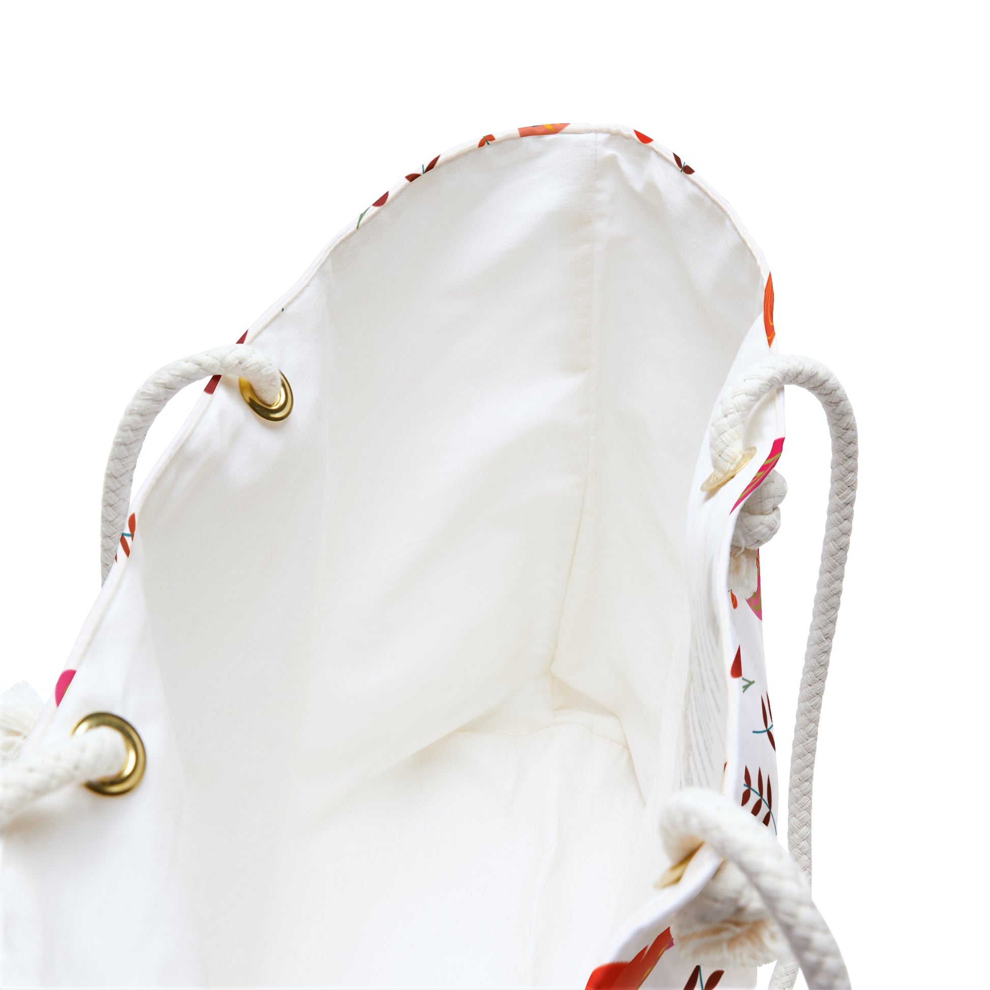 Weekender Bag interior with white lining and braided rope handles through gold grommets, featuring a colorful floral or leaf exterior, ideal for stylish travels with spacious, wrinkle-resistant polyester design.