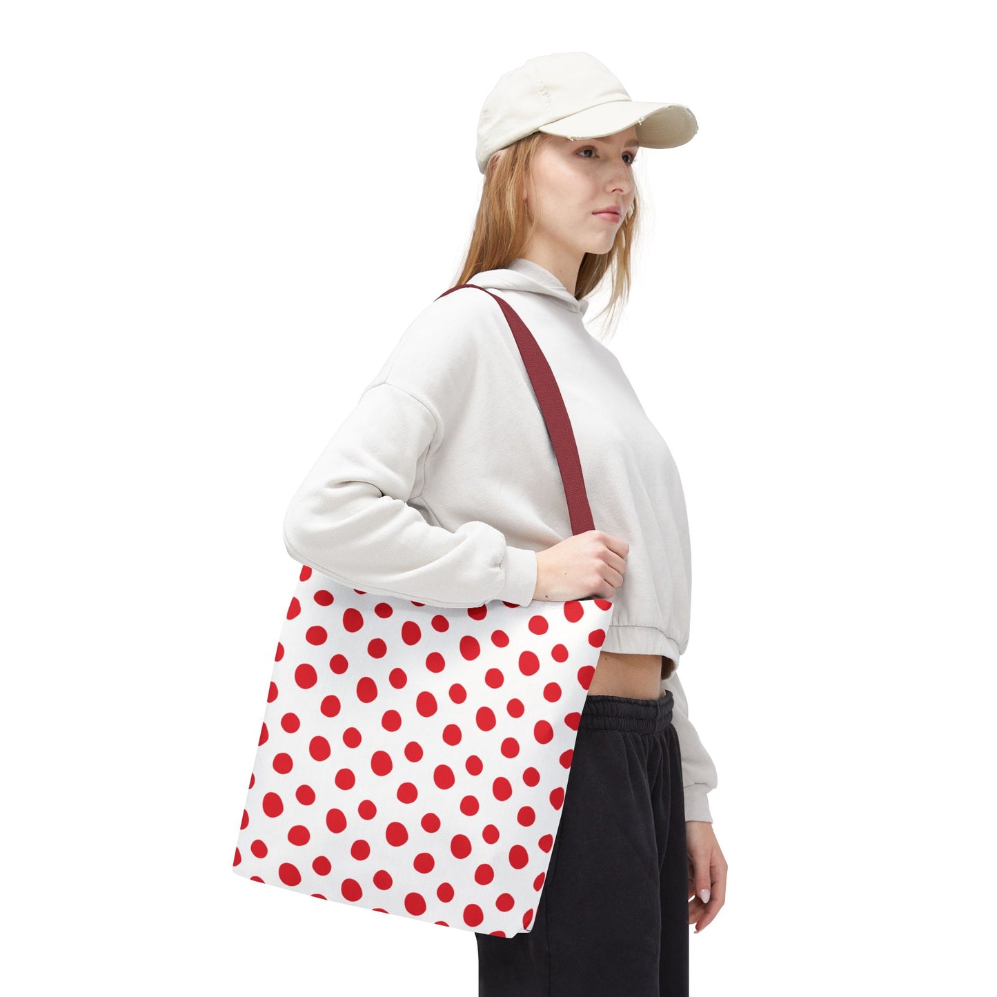 Red Polka Dots Tote Bag featuring playful red polka dots on a durable polyester body, perfect for everyday use. Ideal for errands or beach trips, with reinforced handles and boxed corners for extra space.