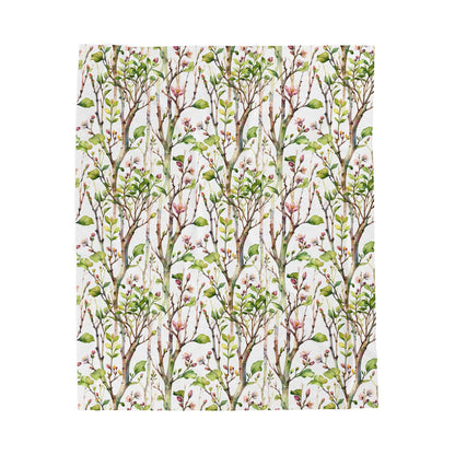 Plush Blanket - Blooming Forest Floor Design features a pattern of tree branches with pink flowers and budding leaves, embodying a serene, nature-inspired vibe. Perfect for cozy comfort and gifting occasions.