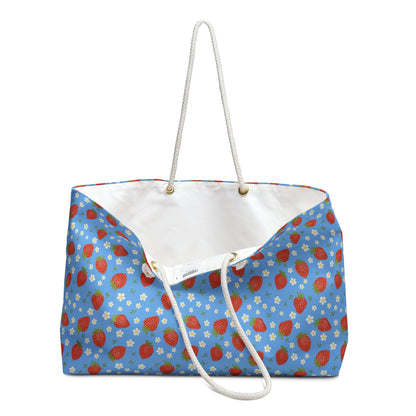 Weekender Bag with Strawberry Design featuring a vibrant strawberry pattern, perfect for travelers and vacationers. It offers ample storage with a durable polyester exterior and comfortable rope handles, ideal for joyful getaways.