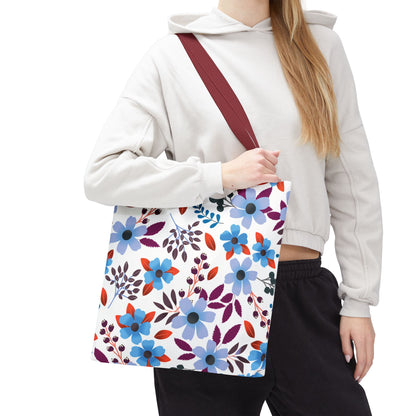 Floral Tote Bag featuring a vibrant pattern of stylized flowers and leaves, carried by a person in casual attire. This versatile tote exemplifies FireBrook Essentials' commitment to joyful and practical design.