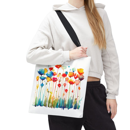 A woman holds the Watercolor Floral Tote Bag, featuring a vibrant floral design, ideal for style and functionality, crafted for durability with reinforced handles.