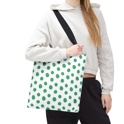 Close-up of a woman holding the Green Polka Dots Tote Bag, showcasing its playful, cheerful design with durable polyester body and reinforced handles, embodying FireBrook Designs' joyful, stylish essence.