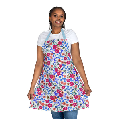 Model wearing Apron Floral Design, featuring a vibrant floral print with green leaves, light blue neck straps. This stain-free, polyester apron offers comfort and style, ideal for various home activities.