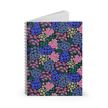 Floral Spiral Notebook with a vibrant floral print of blue, pink, and cream flowers on a dark background, featuring durable metal spiral binding and compact size, perfect for creative and organized note-taking.