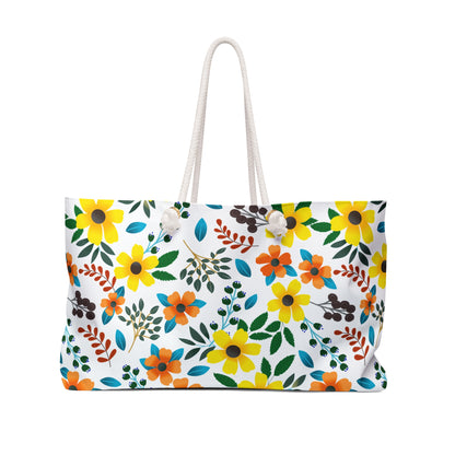 Weekender Bag with a vibrant floral pattern, featuring yellow and orange flowers, teal accents, and rope handles, ideal for stylish travel.