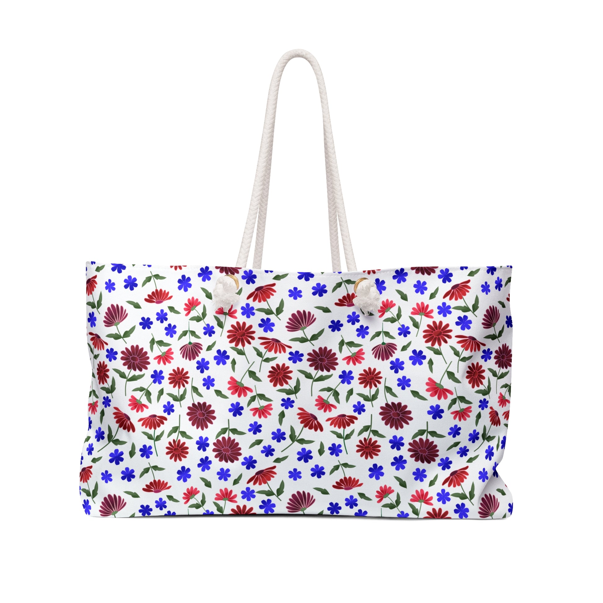 Floral Escape Weekender Bag — A vibrant travel tote with red and blue wildflowers on white, featuring sturdy cream rope handles and gold-tone grommets for a cheerful, summery look.