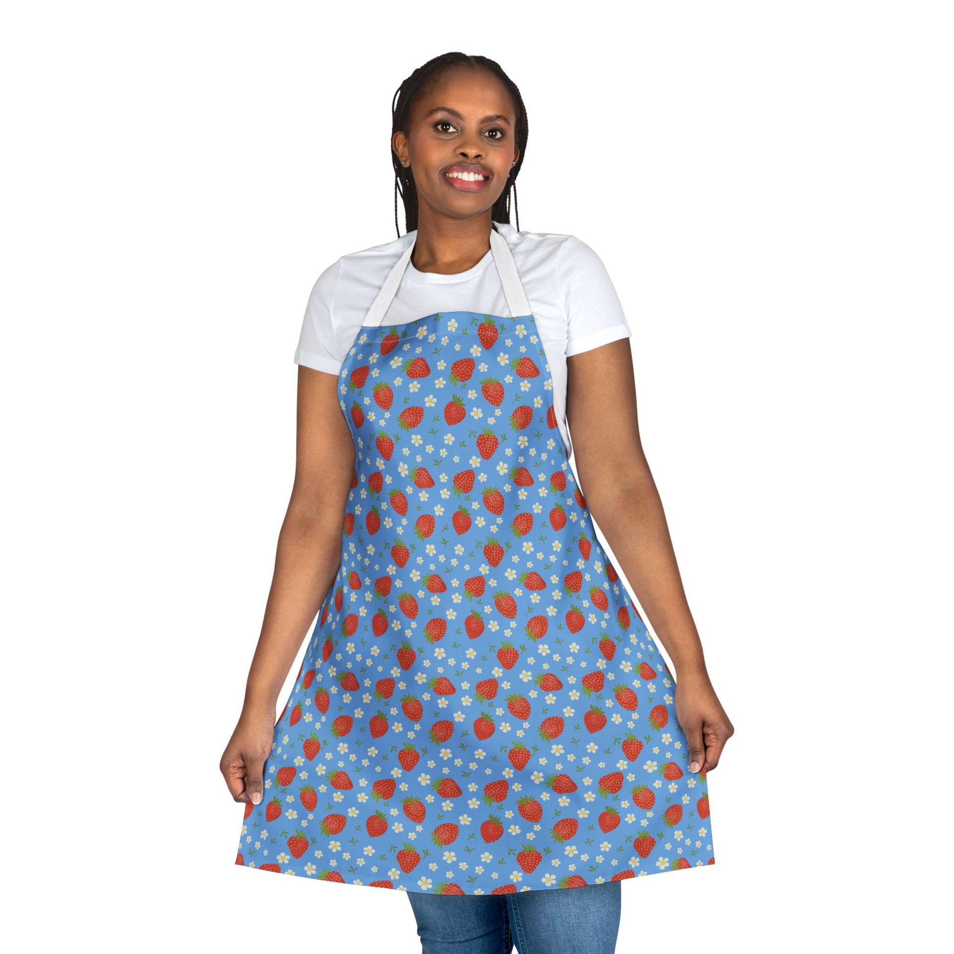 The Apron, Strawberry 5-Color Straps showcases a vibrant strawberry design, worn by a smiling woman in a blue apron, embodying FireBrook Designs' blend of style, comfort, and joy.