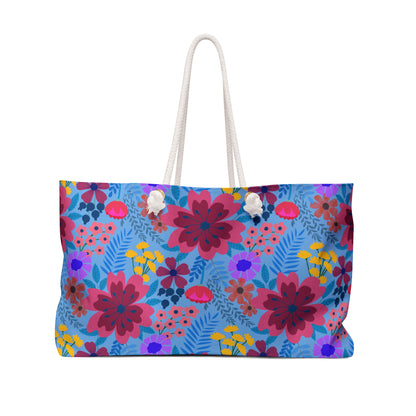 Weekender Bag with vibrant floral pattern and rope handles, perfect for stylish travel. Made of durable spun polyester, it offers ample storage and a luxurious cream interior.