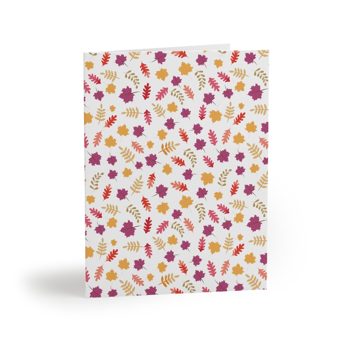 Autumn Greeting Cards — Pack of 8/16/24 feature a folded cardstock with a vibrant autumn-leaf pattern in orange and purple tones. Each card includes a matching white envelope, perfect for sending thoughtful messages.