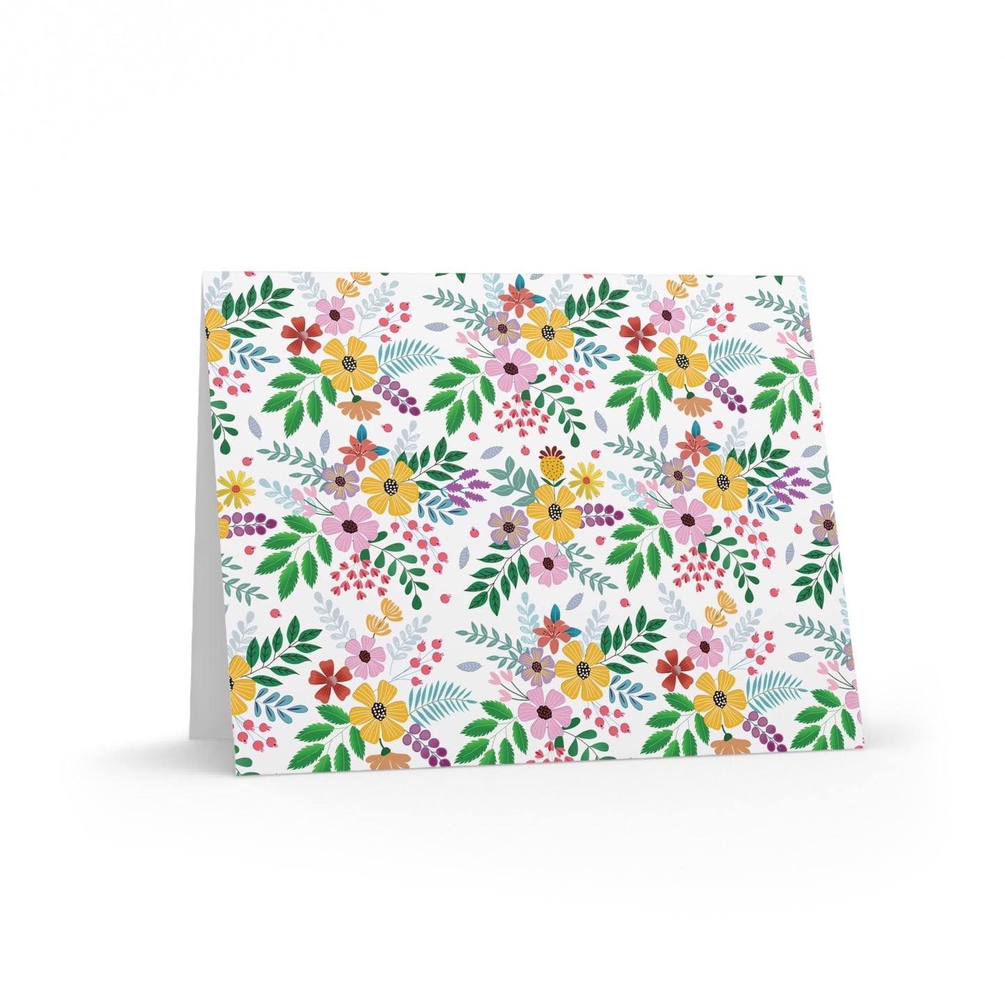 Floral Greeting Cards — Pack of 8/16/24 feature a vibrant, hand-drawn botanical pattern with wildflowers and leaves. The cards stand open, showcasing their elegant matte finish and matching white envelopes.