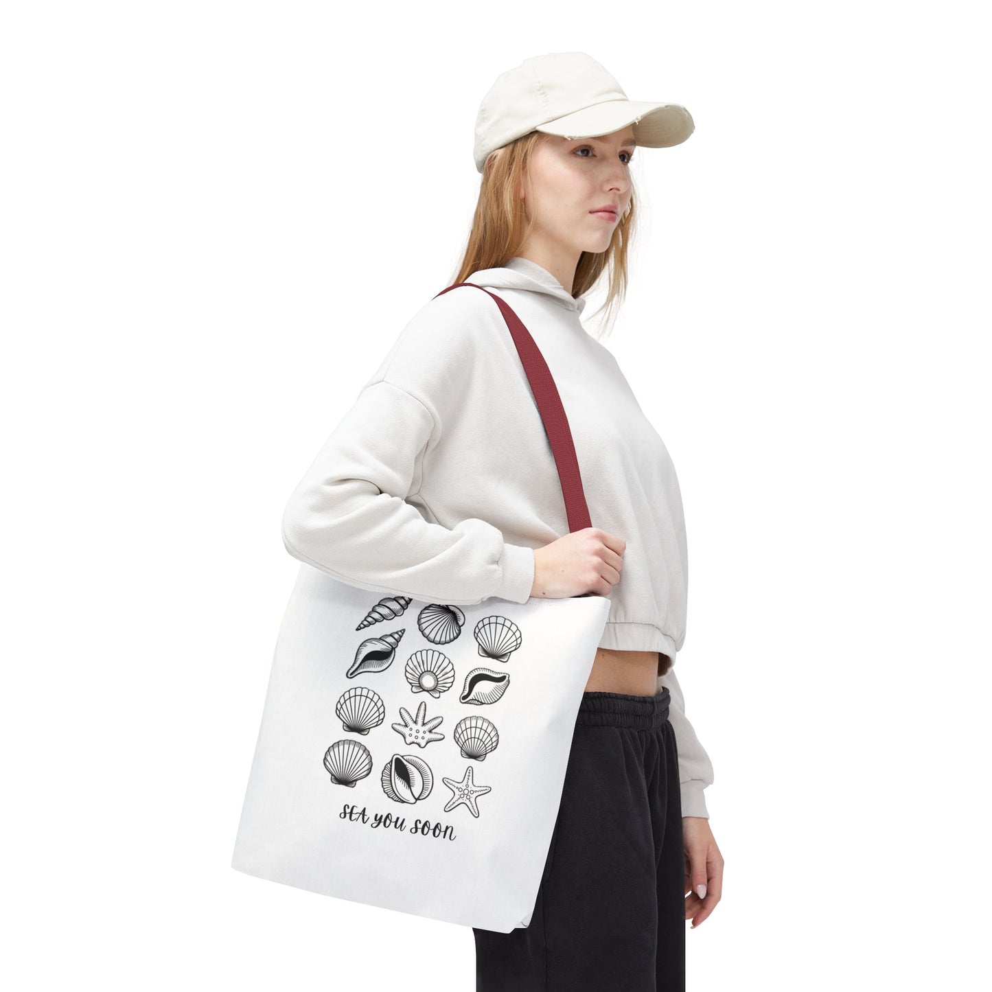 Sea Shells Tote Bag with a beachy design, featuring durable polyester fabric and reinforced stitching, ideal for seaside trips. Available in various sizes, it embodies FireBrook Essentials' ethos of style and joy.