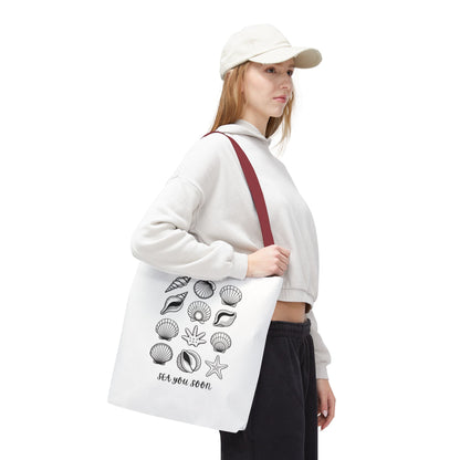 Sea Shells Tote Bag with a beachy design, featuring durable polyester fabric and reinforced stitching, ideal for seaside trips. Available in various sizes, it embodies FireBrook Essentials' ethos of style and joy.