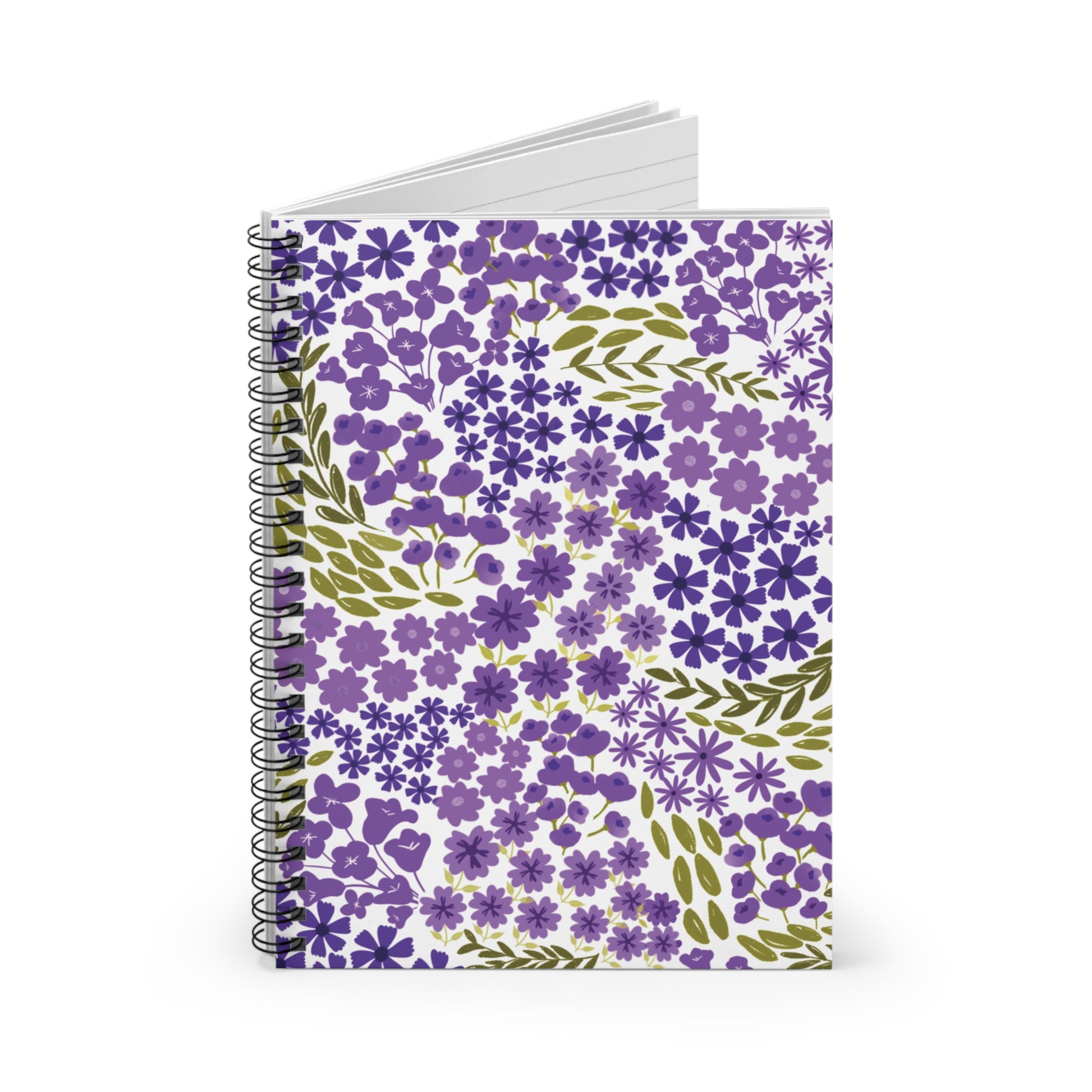 Floral Spiral Notebook featuring a dense pattern of purple flowers and green leaves, with a sleek metal spiral binding and a glimpse of ruled pages, embodying FireBrook Designs' uplifting style.