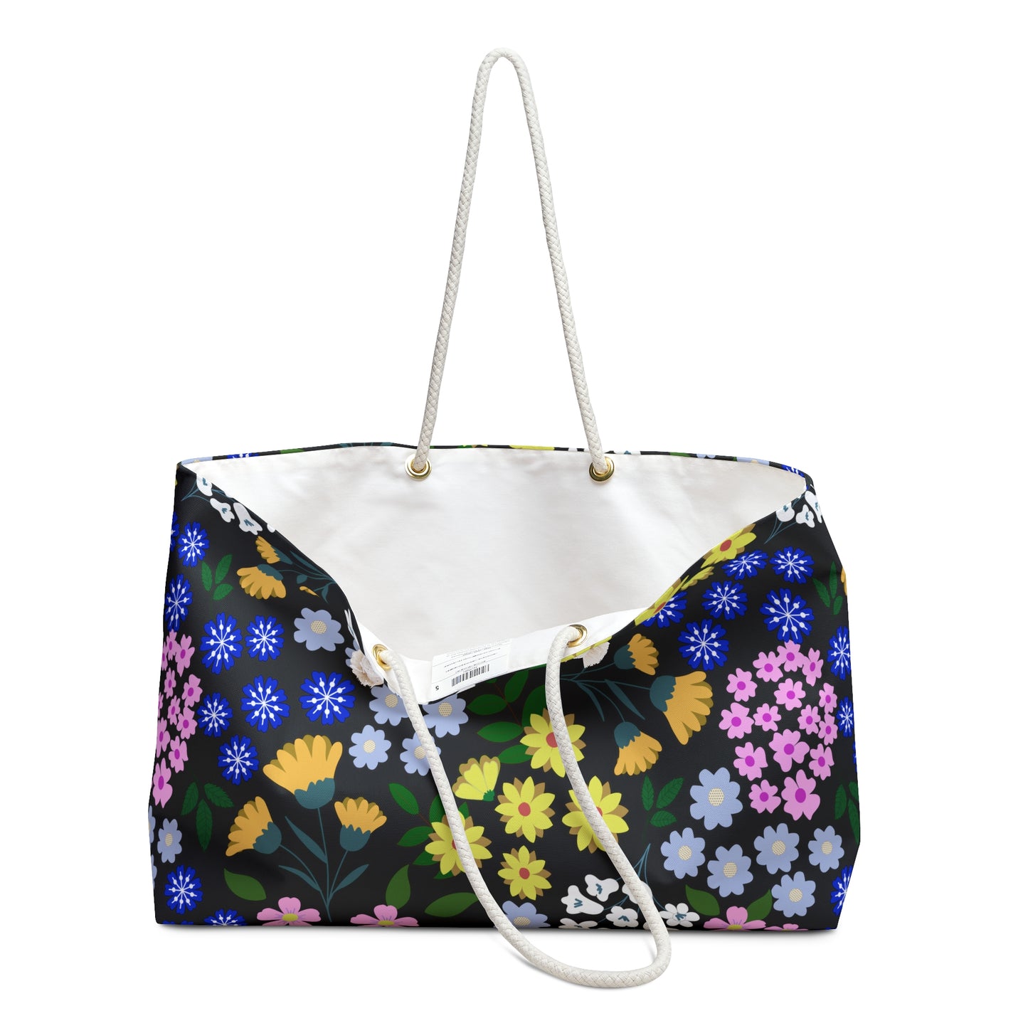 Weekender Bag with floral design on black canvas-like material, featuring rope handles through metal grommets and a spacious, cream-lined interior. Ideal for stylish travel and weekend trips.