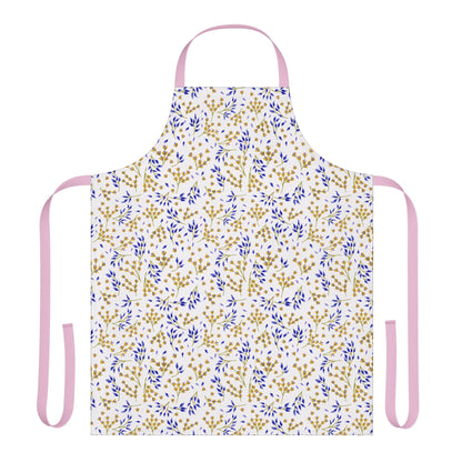 Floral Apron from FireBrook Designs: A stylish, stain-free kitchen apron featuring yellow and blue foliage on white fabric, with pale pink ties, offering comfort and vibrant design for joyful cooking experiences.