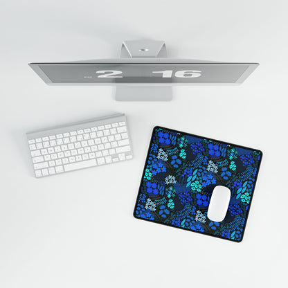 Blue Floral Desk Mat displayed in a minimalist setup, featuring vibrant hand-drawn blue and teal florals. Complements a sleek silver monitor, white keyboard, and mouse, adding elegance and positivity to your workspace.