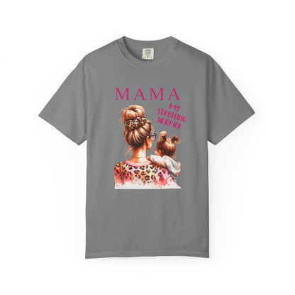 MAMA - My Strolling Sidekick T-Shirt: A unisex garment-dyed tee with 'MAMA' design, showcasing a relaxed fit and classic crew neckline, emphasizing comfort and the bond between mother and child.