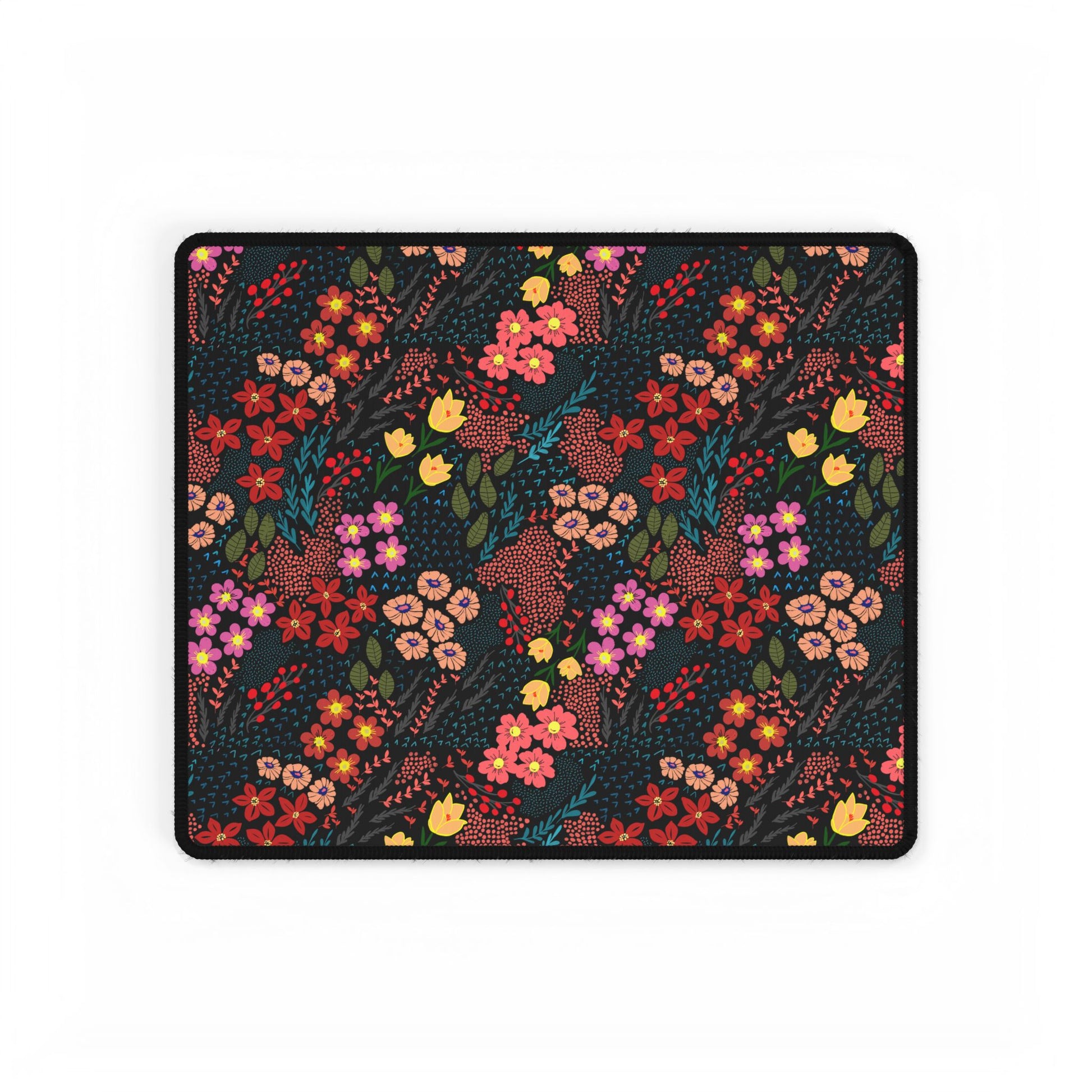 Desk Mat - Midnight Garden Floral Pattern features a dark field with vibrant floral motifs, ideal for nature enthusiasts. Its smooth surface and durable rubber base enhance your desk with colorful elegance.