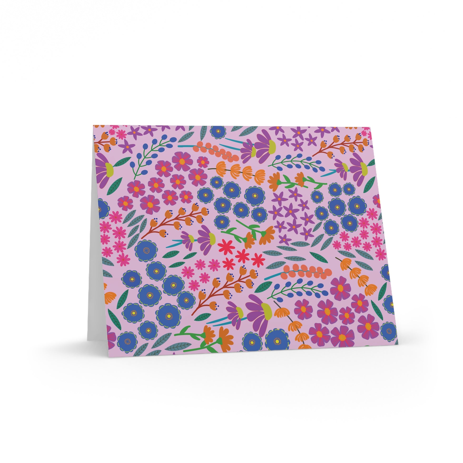 Floral Greeting Cards — Pack of 8/16/24 feature a whimsical multicolored floral pattern on pale pink. These folded cards are vibrant, elegant, and ready for your personal message, perfect for any occasion.