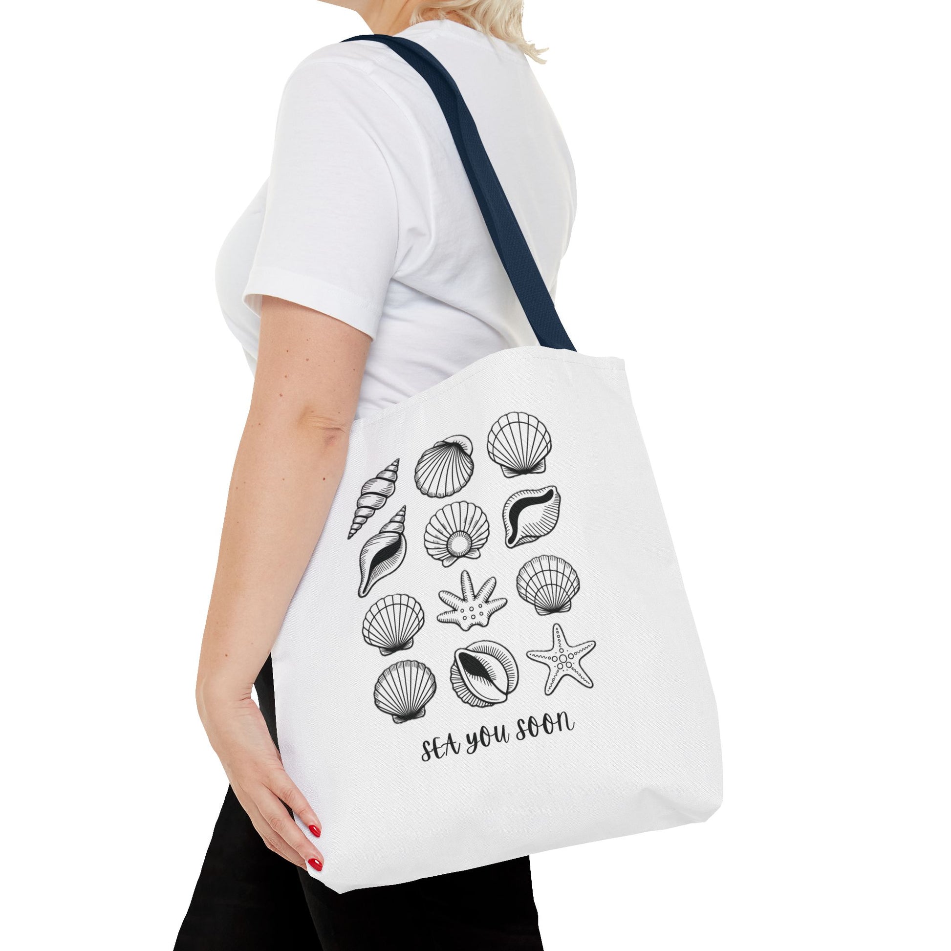 Sea Shells Tote Bag with a beachy design, made from durable polyester and reinforced stitching, ideal for seaside trips. Available in various sizes with 5 color handle options, embodying FireBrook Essentials' stylish and joyful ethos.