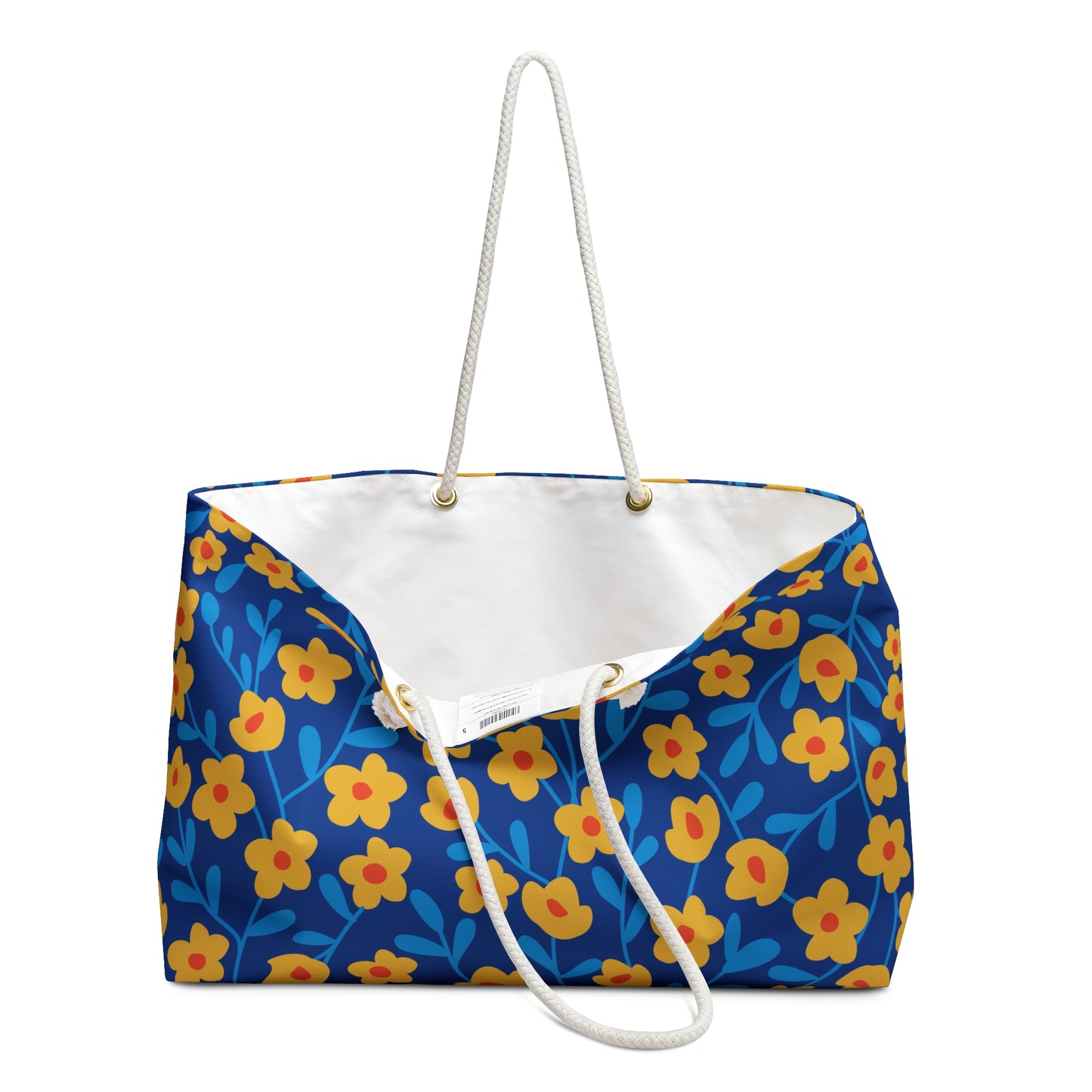 Weekender Bag: A spacious tote with a bright blue floral pattern, featuring sturdy white rope handles and a luxurious cream interior, perfect for stylish travel or weekend getaways.