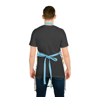 A person wearing a vibrant Floral Apron over a dark t-shirt and jeans, featuring light blue tie-back straps and a colorful pattern, embodying FireBrook Essentials’ blend of comfort and style.