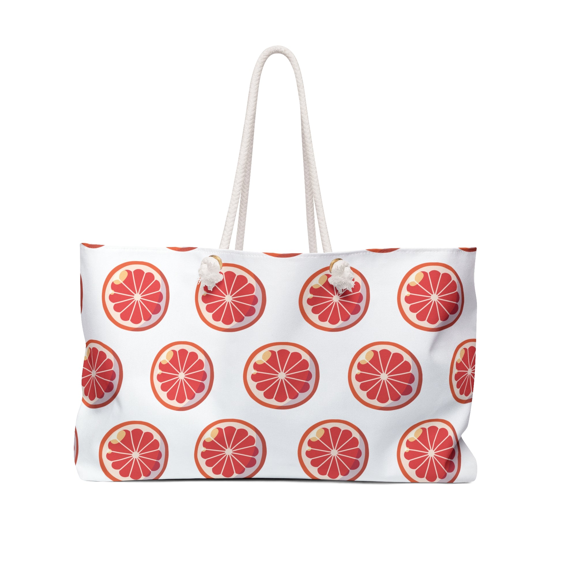 Weekender Bag Orange Slices Print with white tassel, grapefruit logo, and pom details, designed for vibrant, joyful travel. Features durable polyester material, rope handles, and ample storage, reflecting FireBrook Essentials' uplifting style.