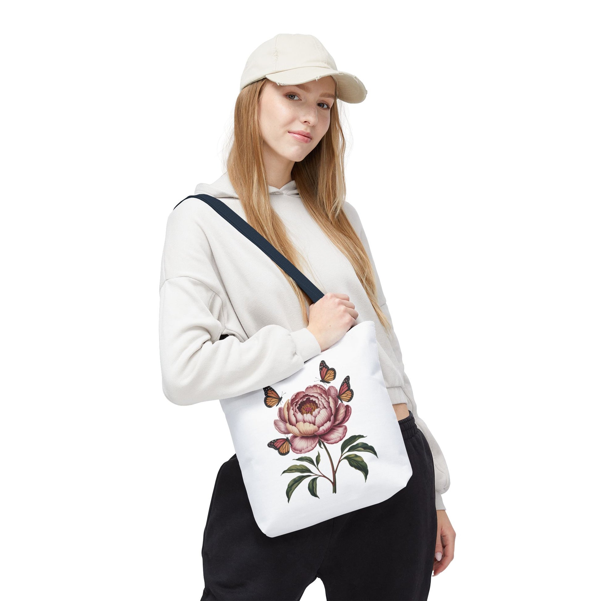 Botanical with Vintage-Inspired Illustration Tote Bag showcasing vibrant flowers, intricate leaves, and fluttering butterflies, ideal for nature lovers. Durable 100% polyester, perfect for various outings. Available in multiple sizes.