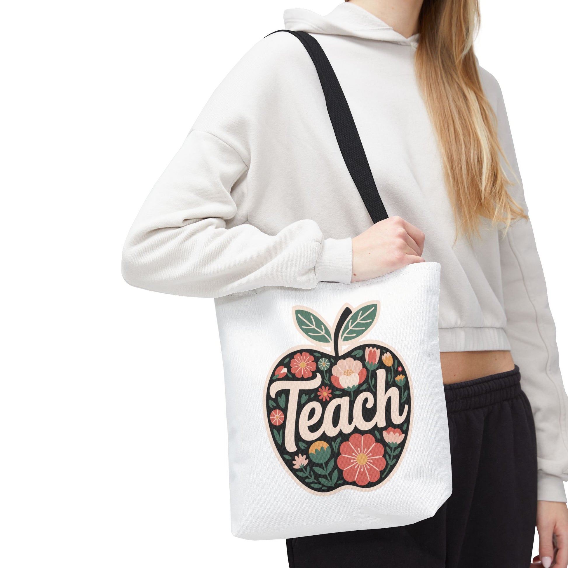 Floral Apple Tote Bag - Hand-Drawn Pastel-Colored Design with 'TEACH' features a cheerful apple shape filled with delicate floral illustrations. Ideal for educators, nature lovers, and special occasions.
