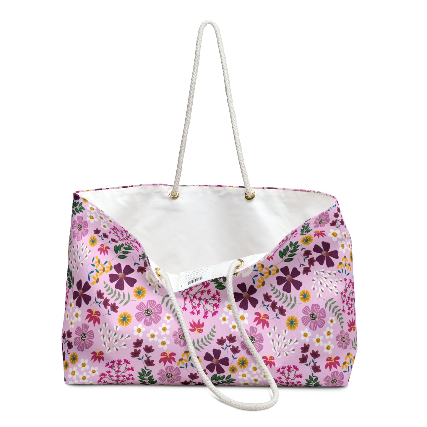 Weekender Bag with a soft pink floral pattern and white rope handles, ideal for stylish travel. Designed for comfort and ease, it embodies FireBrook Essentials' commitment to enhancing joyful, positive experiences.