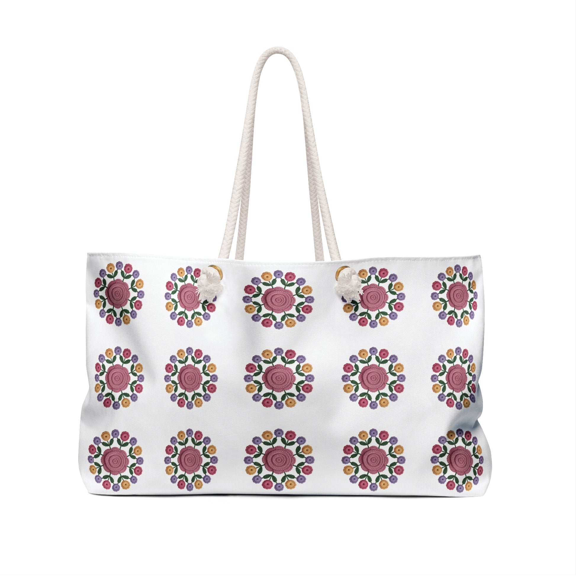 Crochet Floral Weekender Bag showcasing an intricate crochet floral pattern, perfect for weekend trips, with rope handles and a spacious interior, embodying FireBrook Designs' commitment to style and joy.