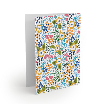 Wildflower Greeting Cards — Pack of 8/16/24 showcases a vibrant floral pattern on a matte-finish card, perfect for spreading joy with personal messages, aligning with FireBrook's uplifting design ethos.