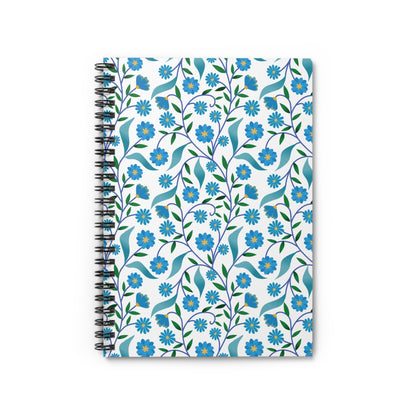 Floral Spiral Notebook featuring a vibrant, all-over floral pattern with blue blossoms and green leaves on a white cover, designed for creativity and organization with durable metal binding and compact portability.