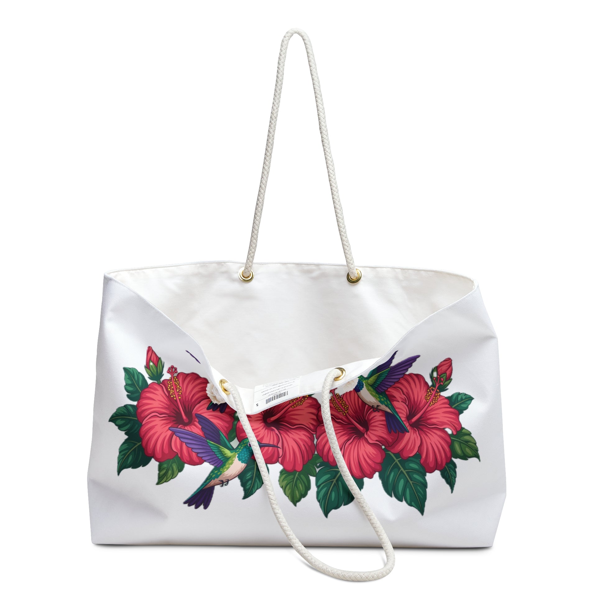 Tote Bag with hummingbirds and hibiscus design, featuring a close-up of a flower and sturdy rope handles with gold metal grommets, ideal for stylish weekend getaways and travel.