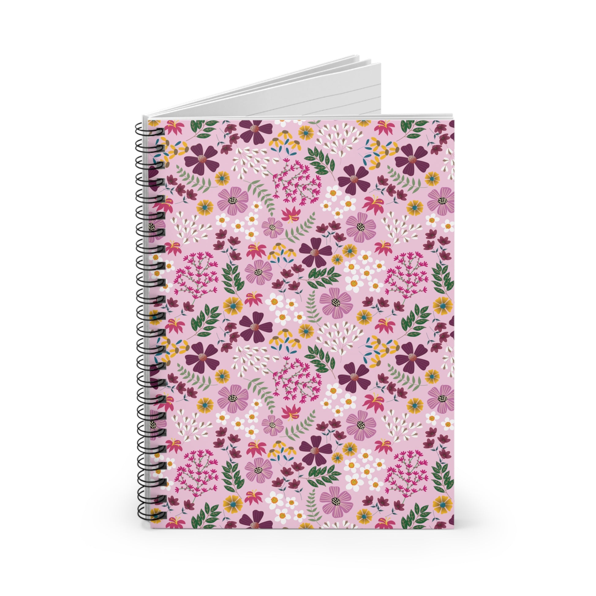 Floral Spiral Notebook with a vibrant floral cover, featuring purple, magenta, white, and yellow flowers on pale pink. Ideal for creative expression with smooth-turning metal binding and lined pages peeking through.