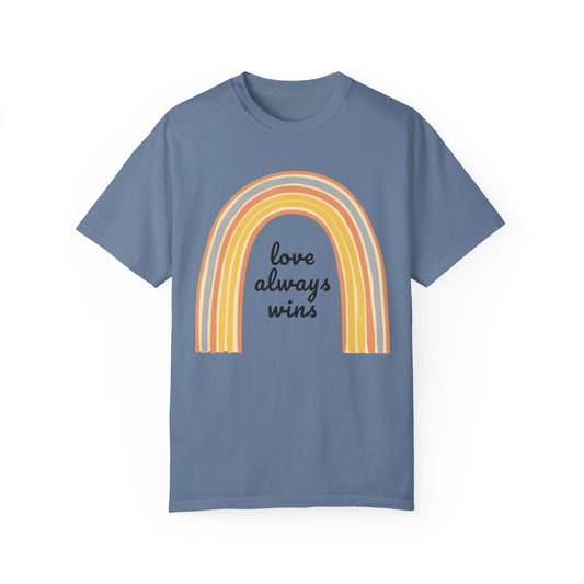 Love Always Wins Rainbow Comfort Colors Unisex T-Shirt featuring a vibrant rainbow design, embodying positivity and inclusivity, perfect for casual wear or celebrating love and equality.